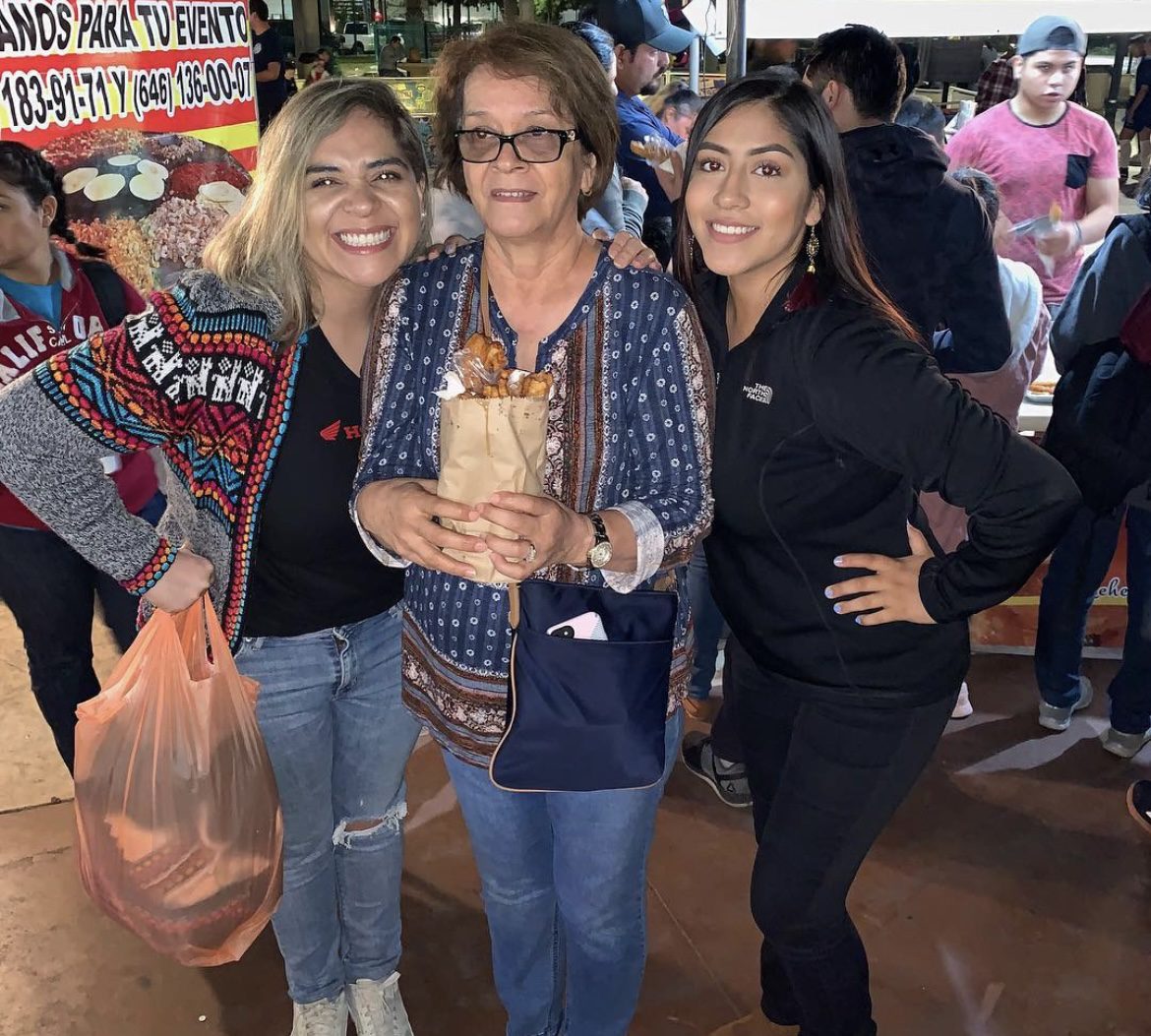 A picture of three women at a festival