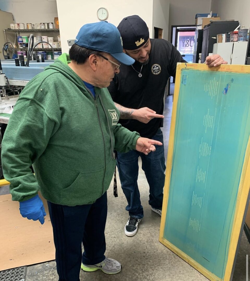 A picture of a man looking at a pattern