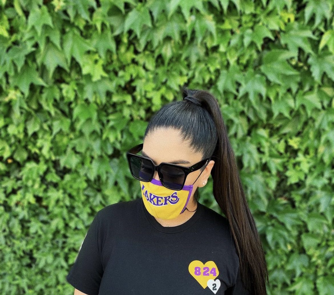 A woman in customized black tshirt and mask