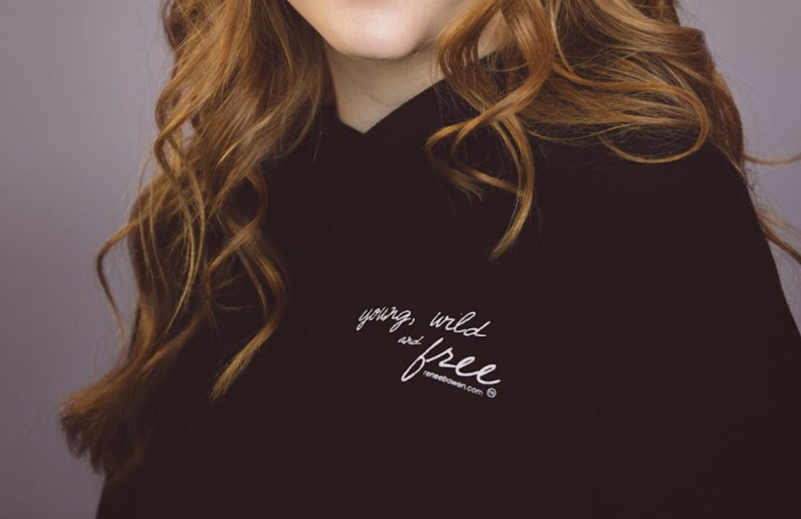 A close-up shot of the customized black hoodie